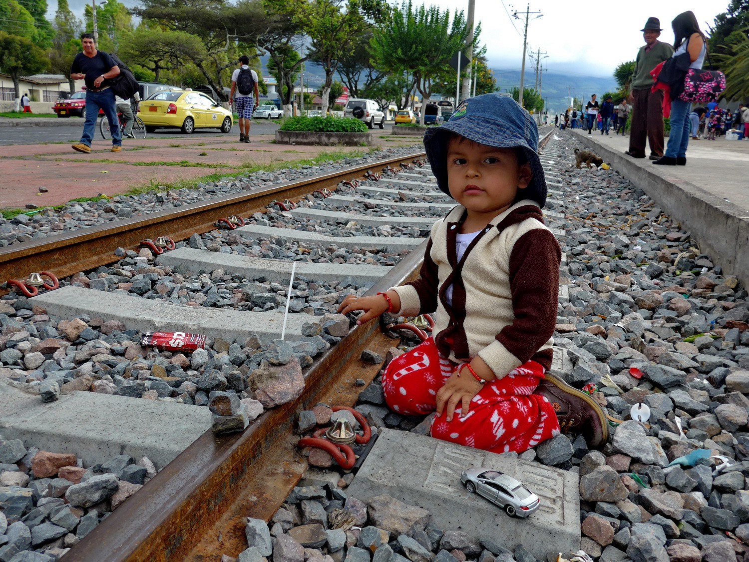Boy playing with the railway of Ibarra